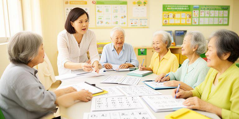 A patient instructor guiding a small group of seniors in a bright Singapore classroom with large-print materials on the table
